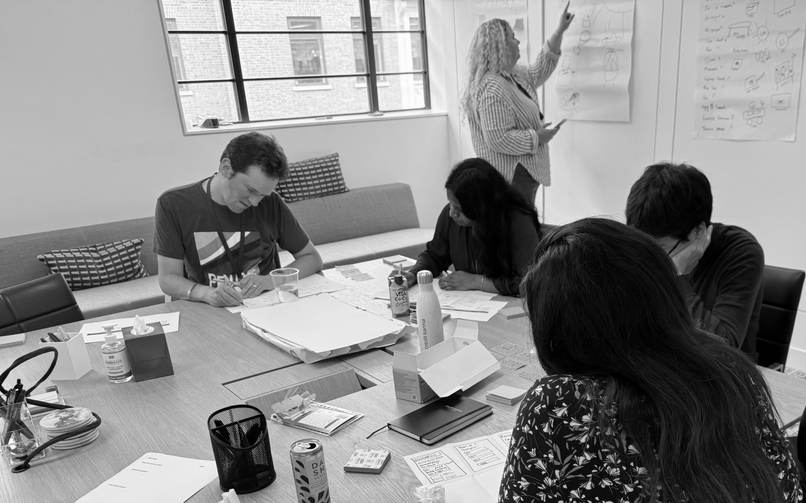 Consumer Duty workshop with a team sketching journey ideas and prioritising actions.